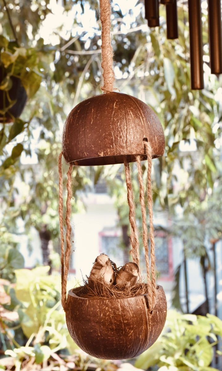 Upcycled discarded coconut shell bird feeder Adi bird feeder