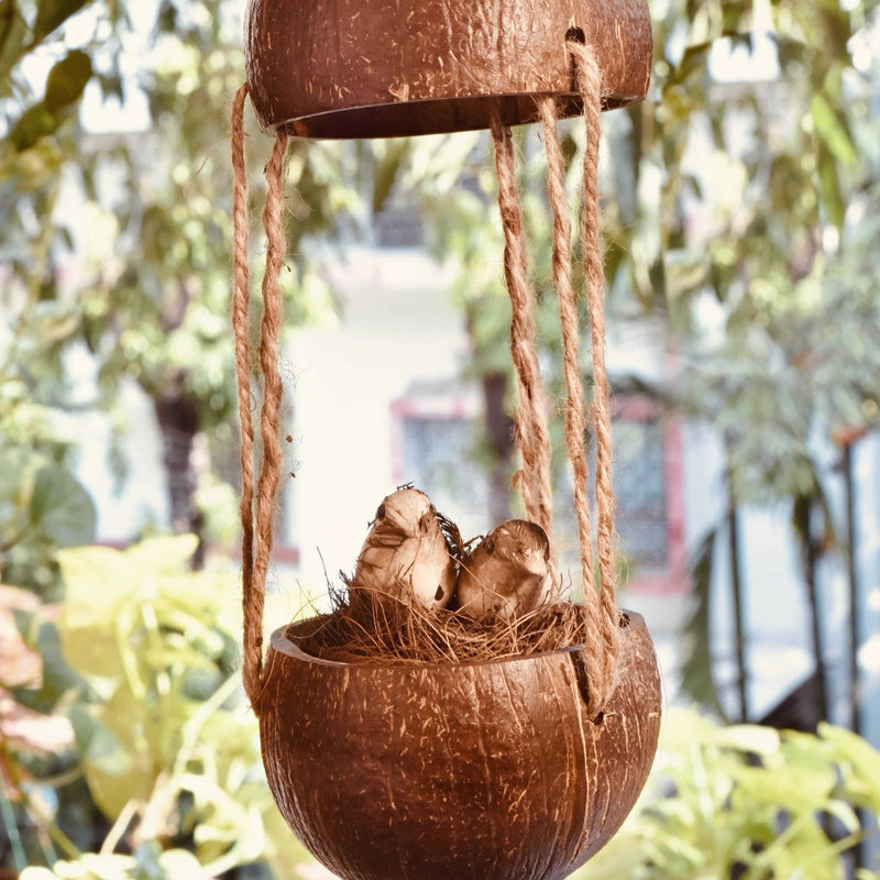 Upcycled discarded coconut shell bird feeder Adi bird feeder