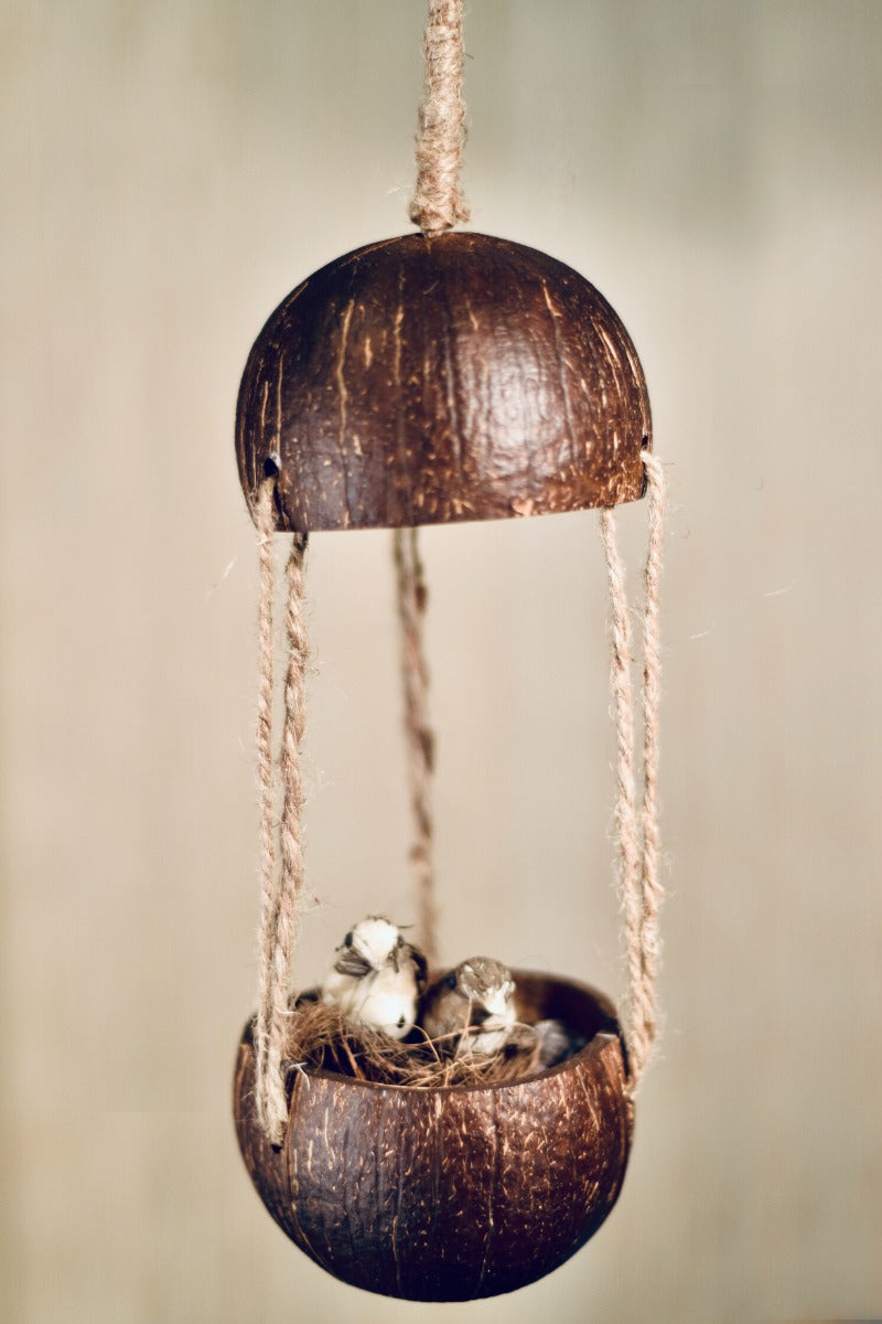 Upcycled discarded coconut shell bird feeder Adi bird feeder