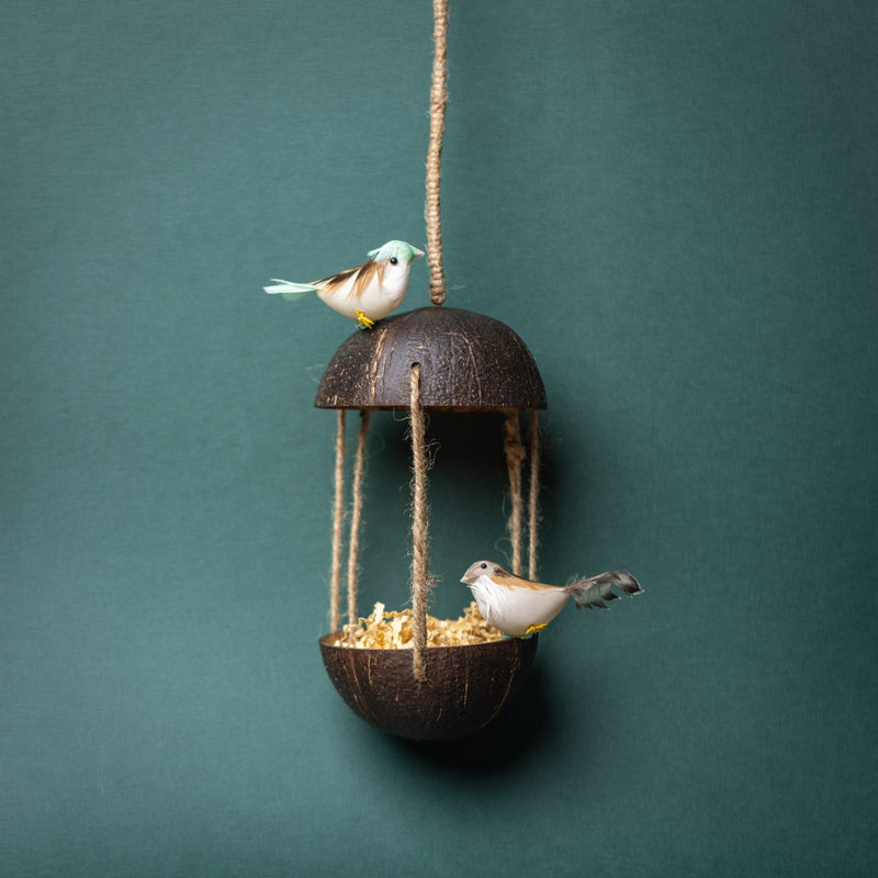 Upcycled discarded coconut shell bird feeder Adi bird feeder